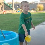 Xavier playing in the water in his backyard in Phoenix